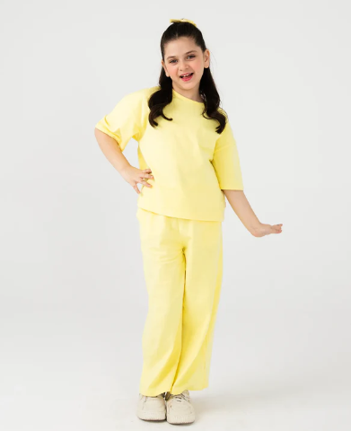 Person wearing a yellow outfit on a white background
